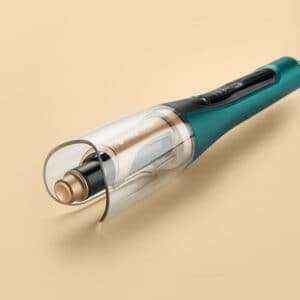 green curling iron in beige background